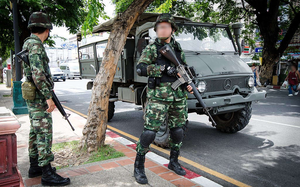 Thai military at Chang Phueak Gate in Chiang Mai. The two ladies at the right hand side of the image are bringing the contingent of soldiers stationed at Chang Phueak Gate lunch.